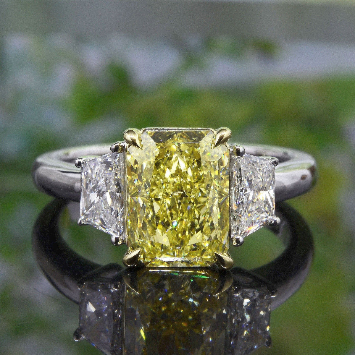 Elongated canary yellow radiant & trapezoids 3 stone ring