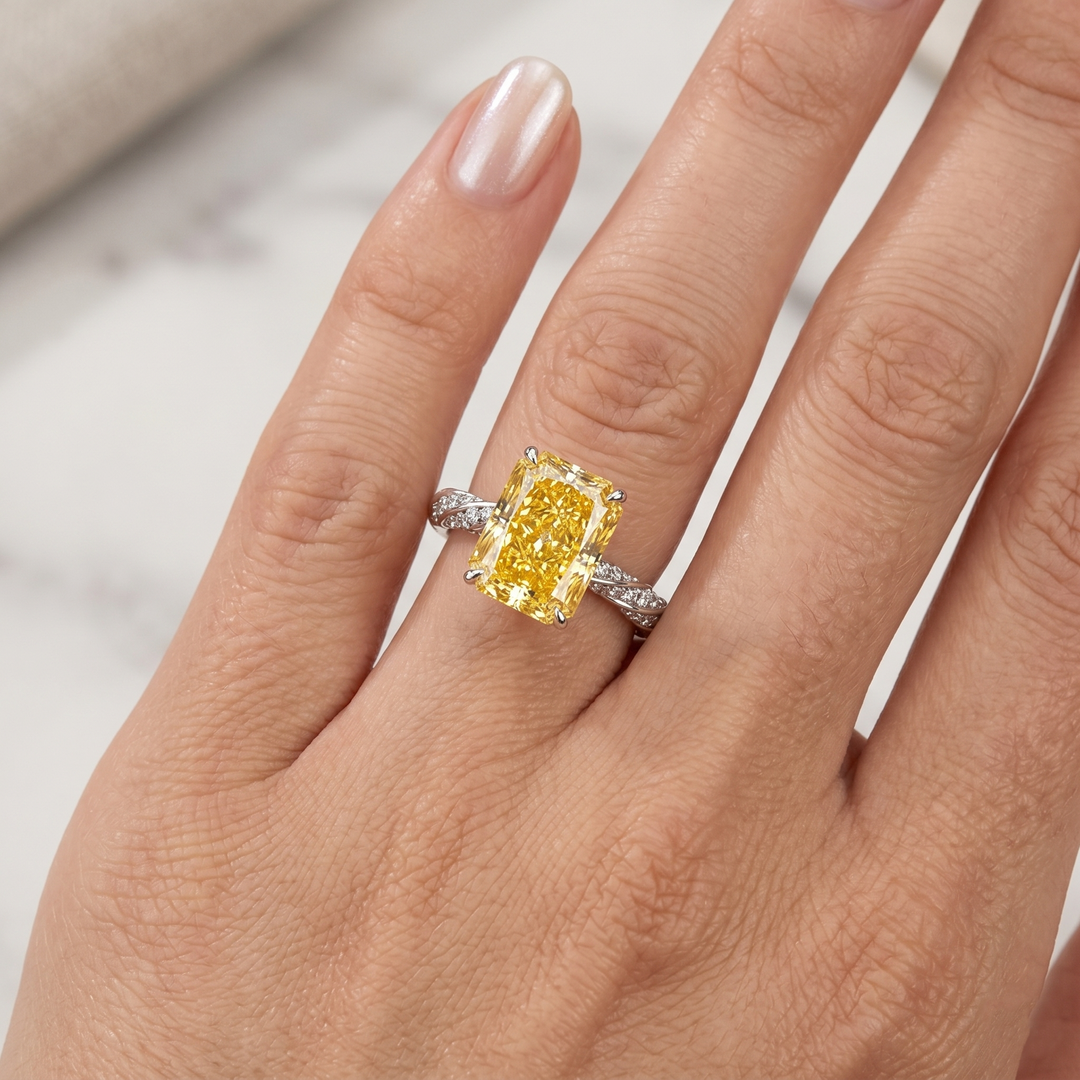 Radiant cut Yellow diamond twist pave ring in white gold on model ring finger