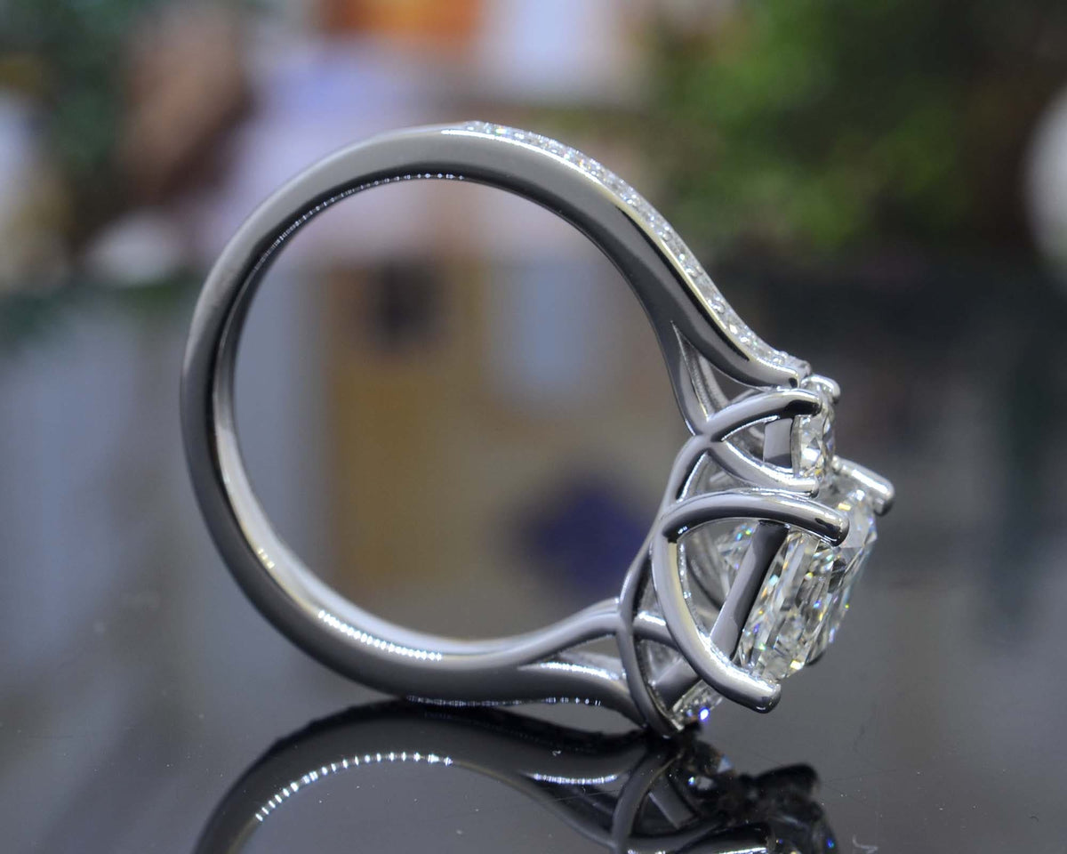 Princess & trapezoids 3 stone ring side view