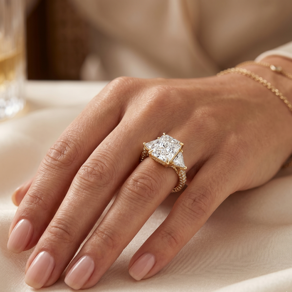 Radiant cut with trillion 3 row pave ring in yellow gold on model's ring finger