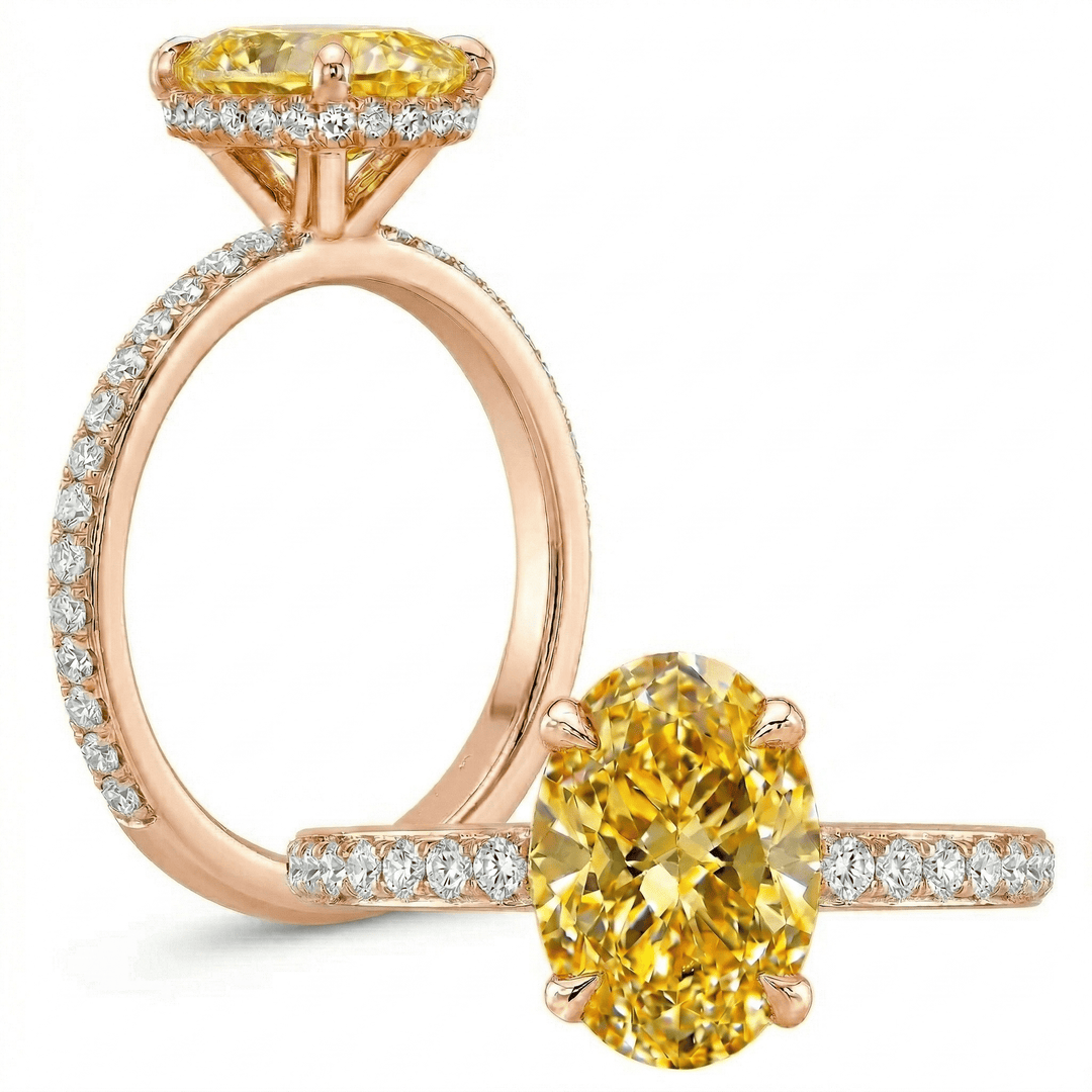 Rose gold ring with yellow gemstone and smaller diamonds on a white background