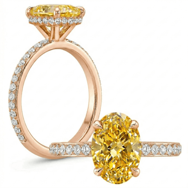 Rose gold ring with yellow gemstone and smaller diamonds on a white background