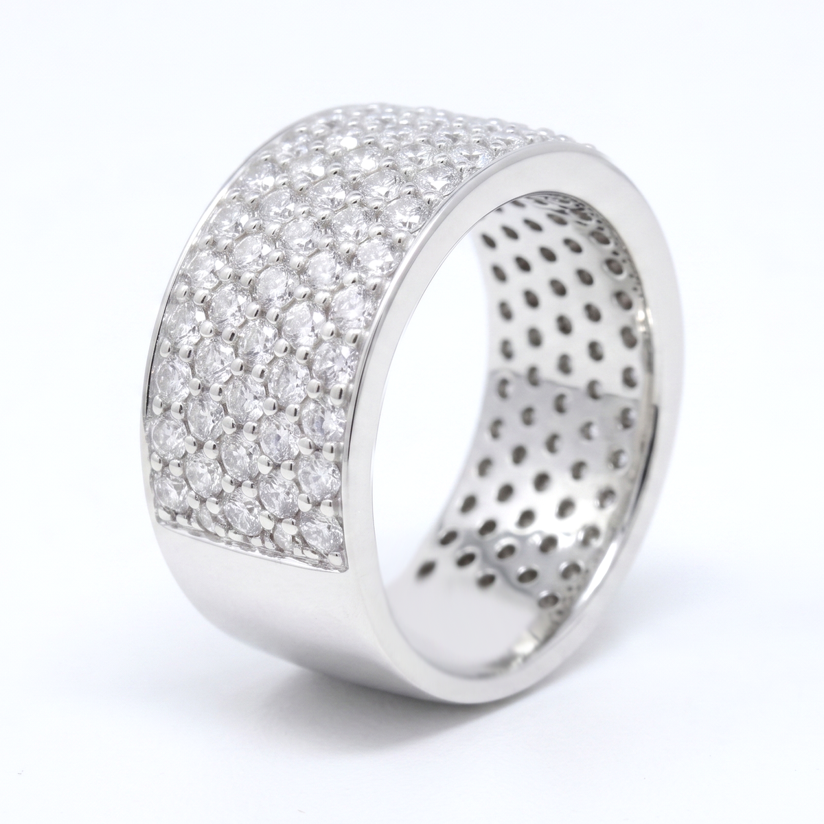 Silver ring with diamond like stones on a white background