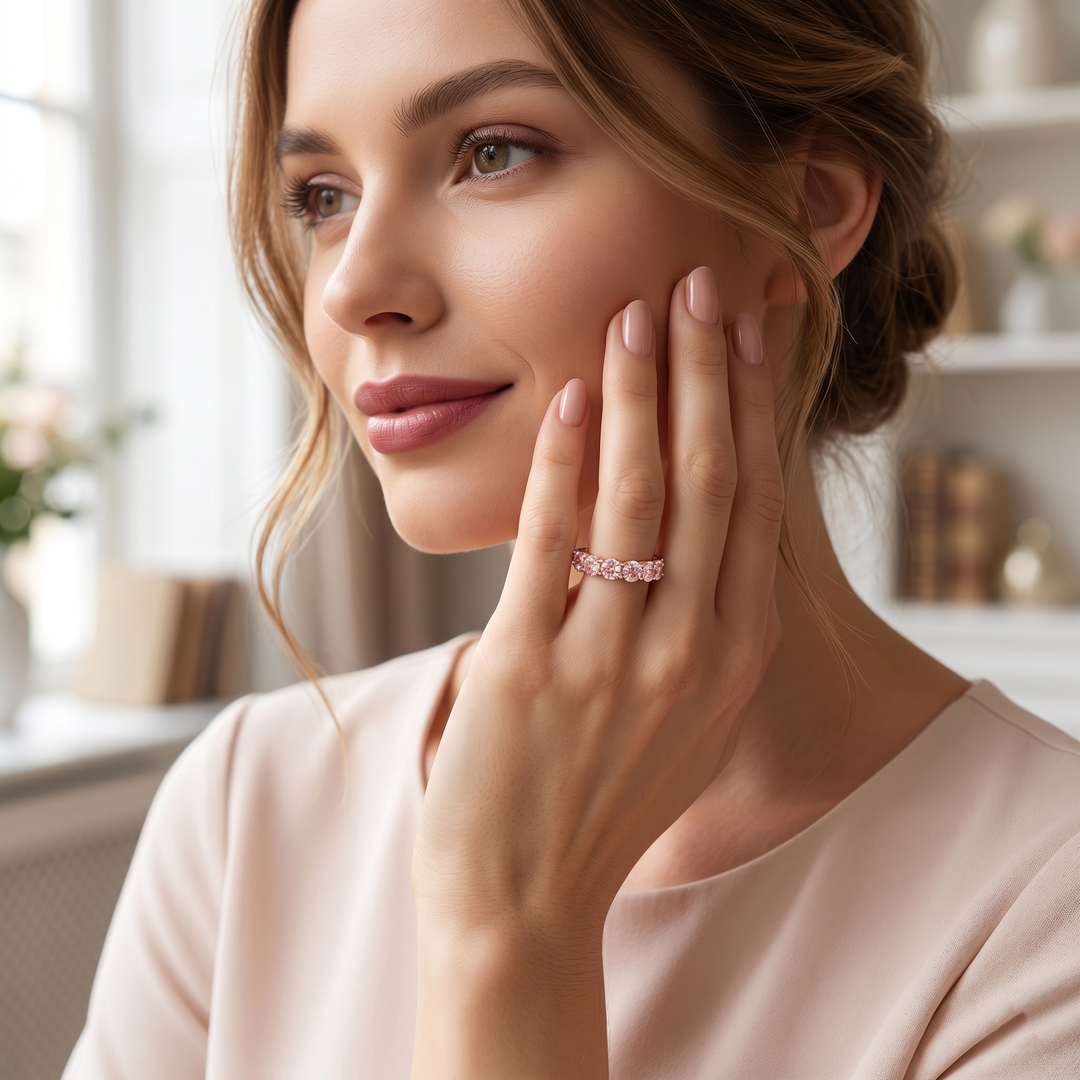 Lab Grown Fancy Intense Pink Eternity Band in rose gold on hand of lady model