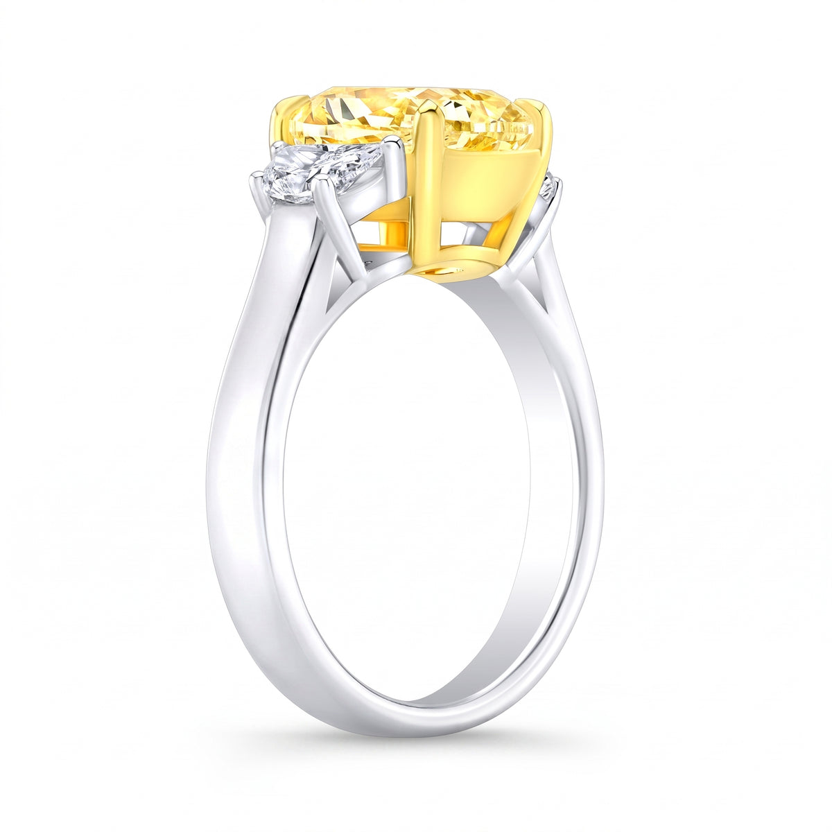 Side view of a yellow cushion and white half moons on a two tone ring