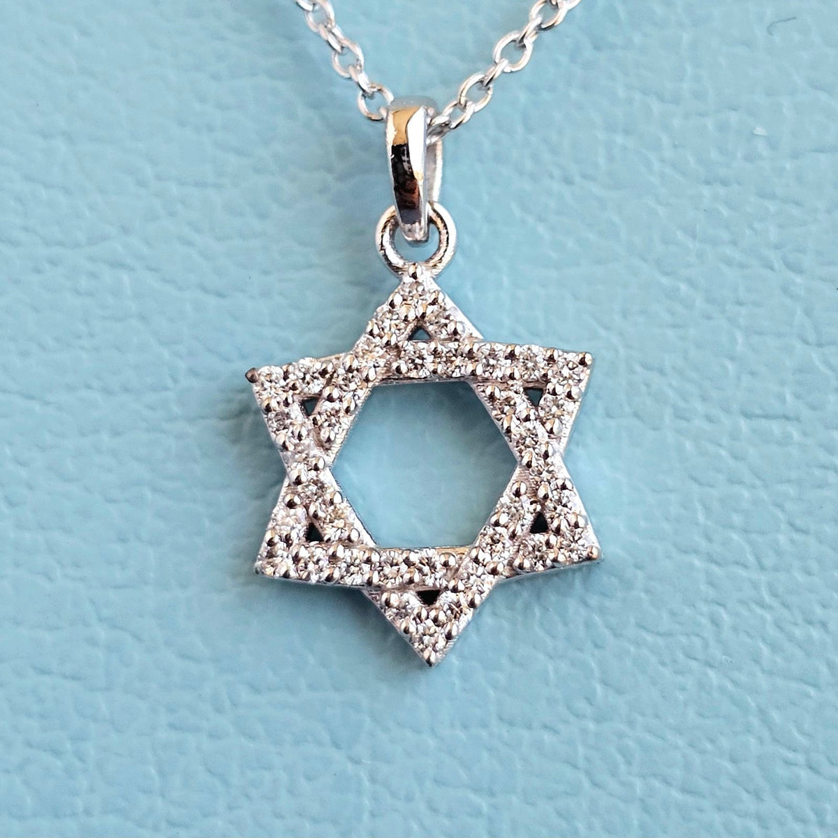 Pave set diamond star of david pendant with chain magnified