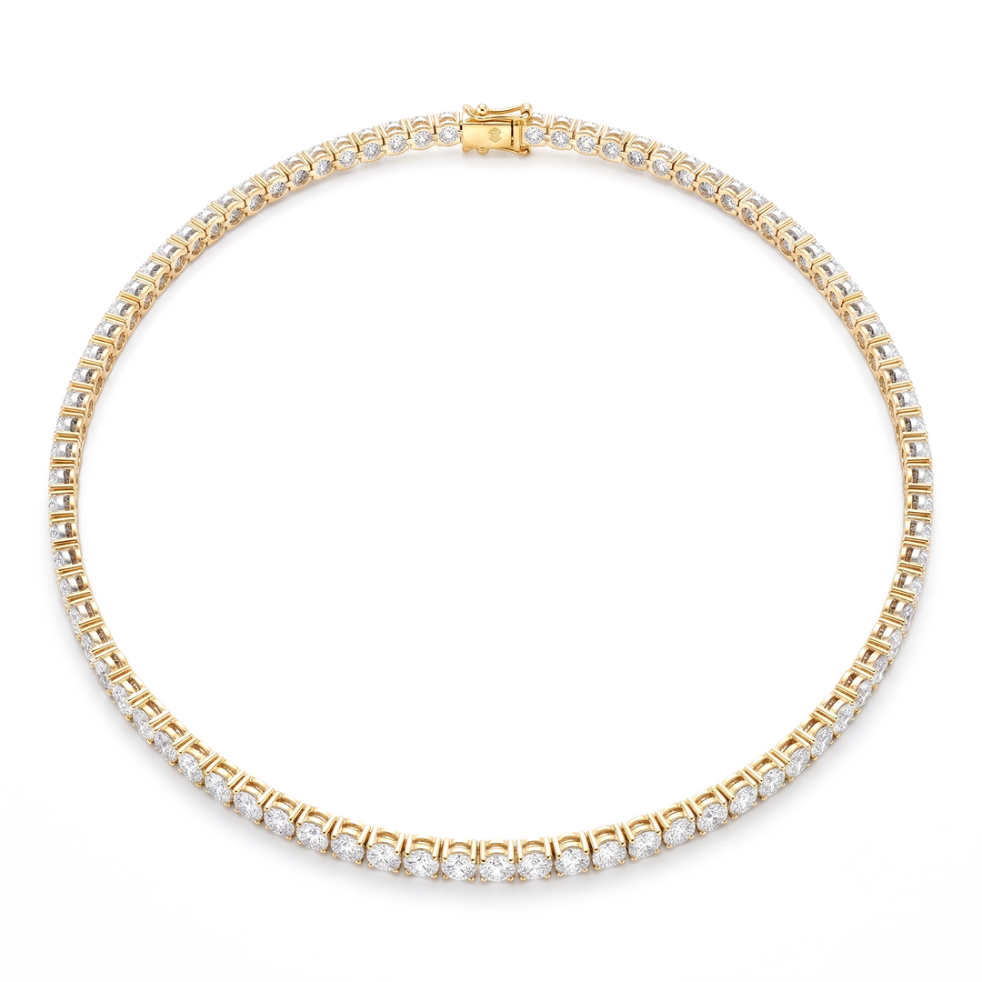 Yellow gold Tennis Necklace on a white background