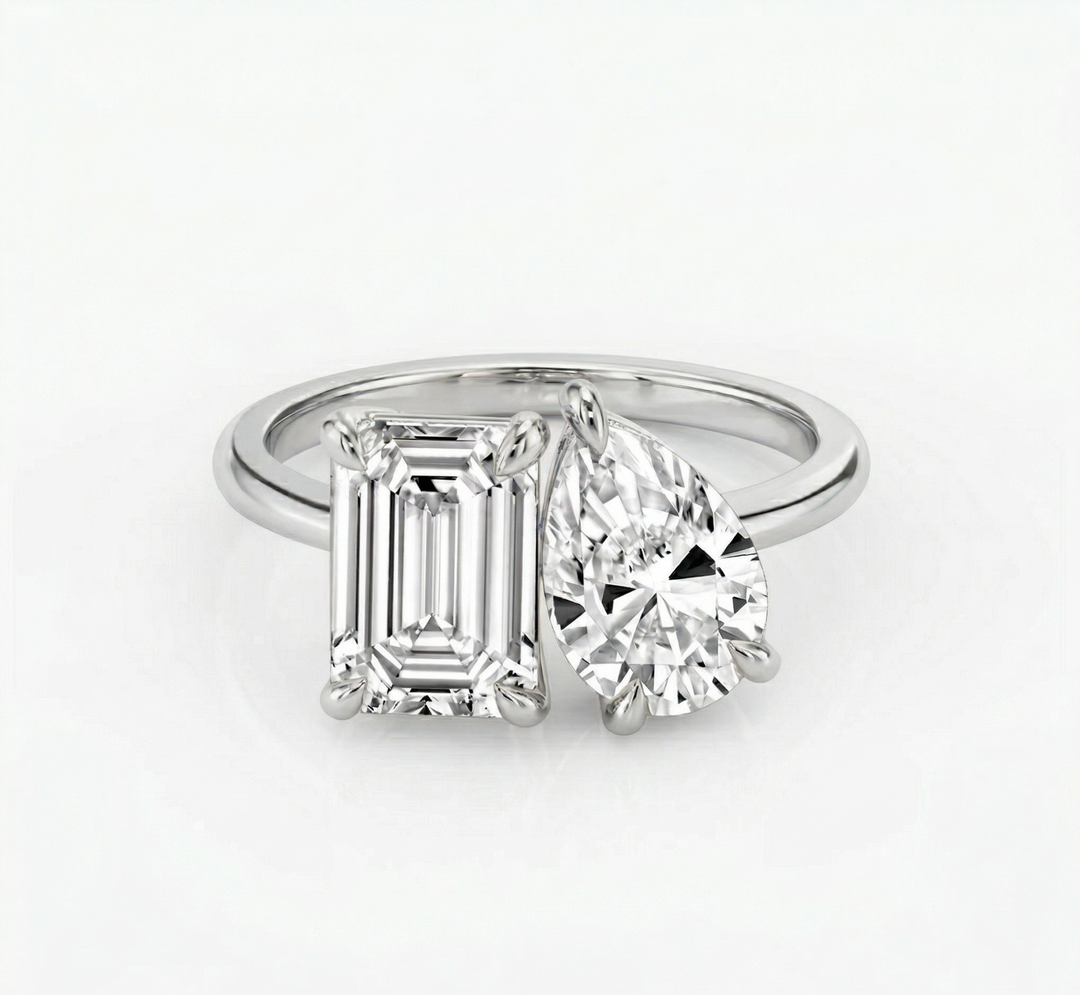 Toi et Moi Emerald & Pear cut diamond ring in white gold