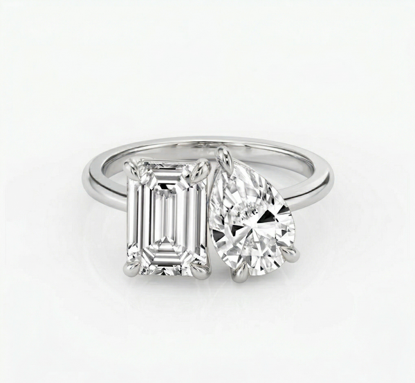 Toi et Moi Emerald & Pear cut diamond ring in white gold