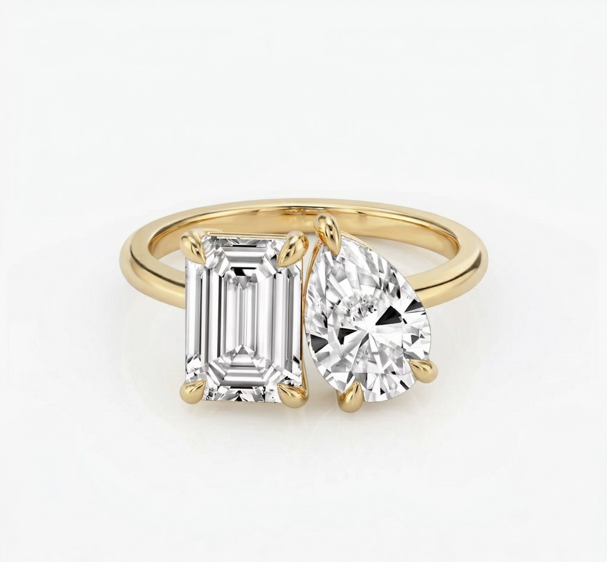 Toi et moi emerald & pear cut diamond ring in yellow gold