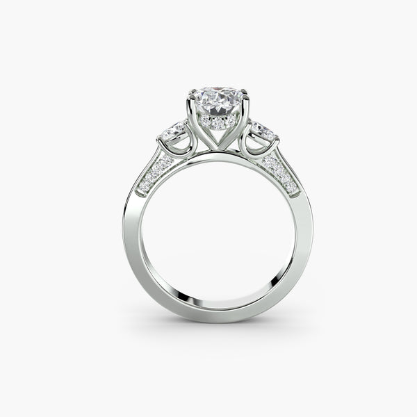 Three Stone Pear Cut with Subtle Round Cut Diamond Ring