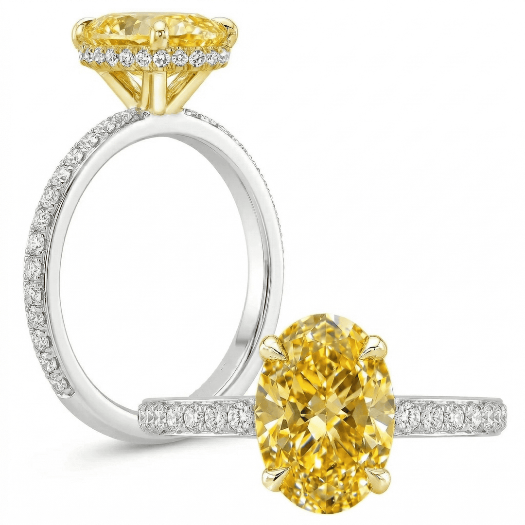 Yellow Gold and white gold ring with yellow oval canary on a white background