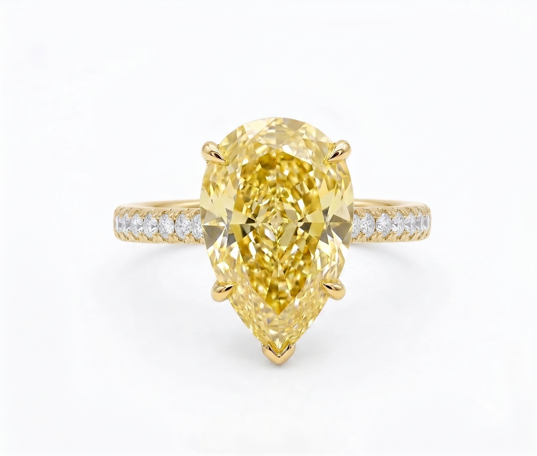 Yellow Pear cut hidden halo single shank with accent diamonds yellow gold