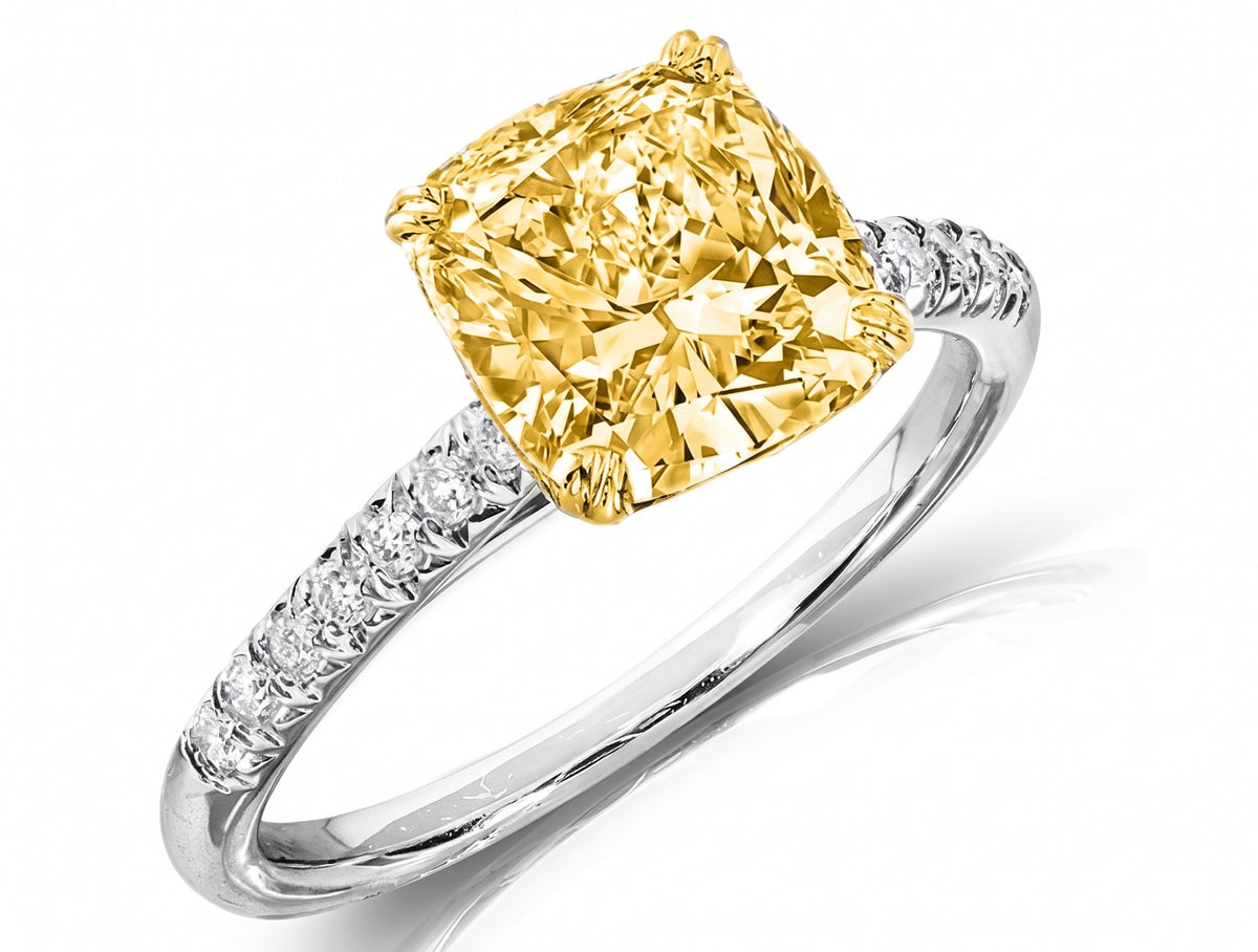 Yellow_cushion_in_solitaire_with_side_diamonds_in_tow_tone_gold