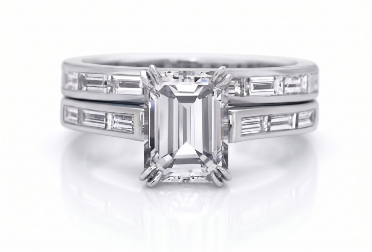 Baguette_channel_engagement_set_with_emerald_cut_center_stone_white_gold