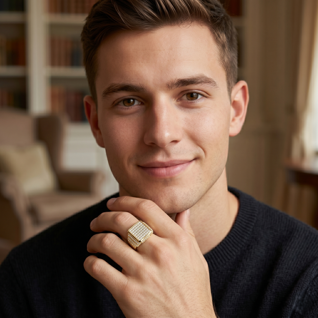 Men's rectangle pave diamond ring in yellow gold worn by  a male model on his middle finger 
