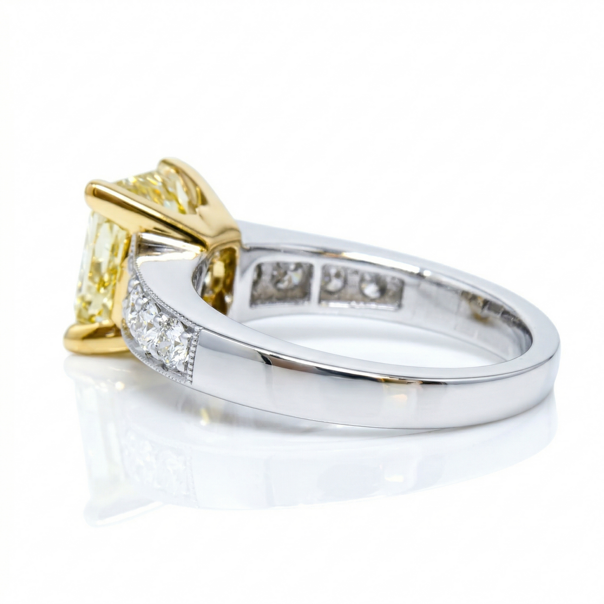 Elongated canary cushion cut diamond ring side view