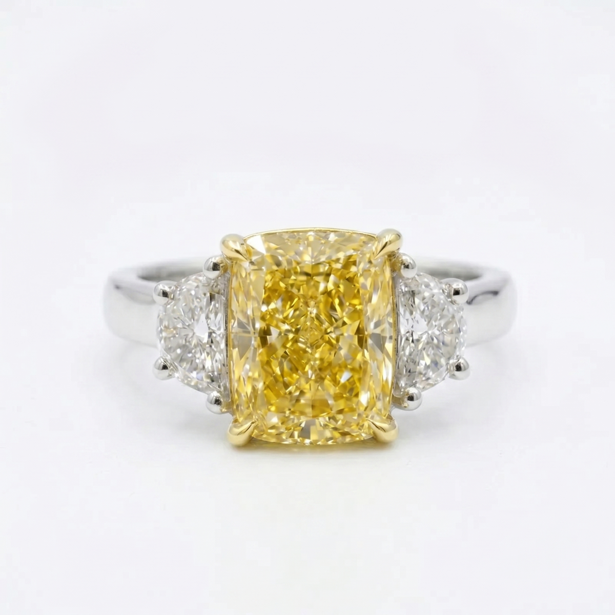 Elongated yellow cushion with halfmoon 3 stone ring in white gold