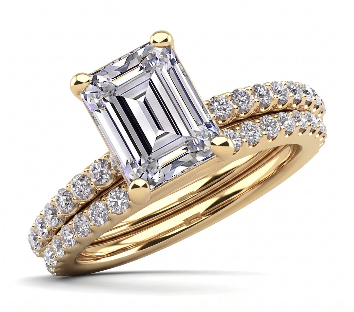 Emerald_cut_engagement_ring_set_with_a_matching_band_yellow_gold