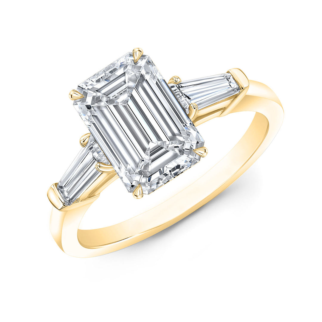 Emerald cut with Tapered Baguette 3-stone diamond ring in yellow gold