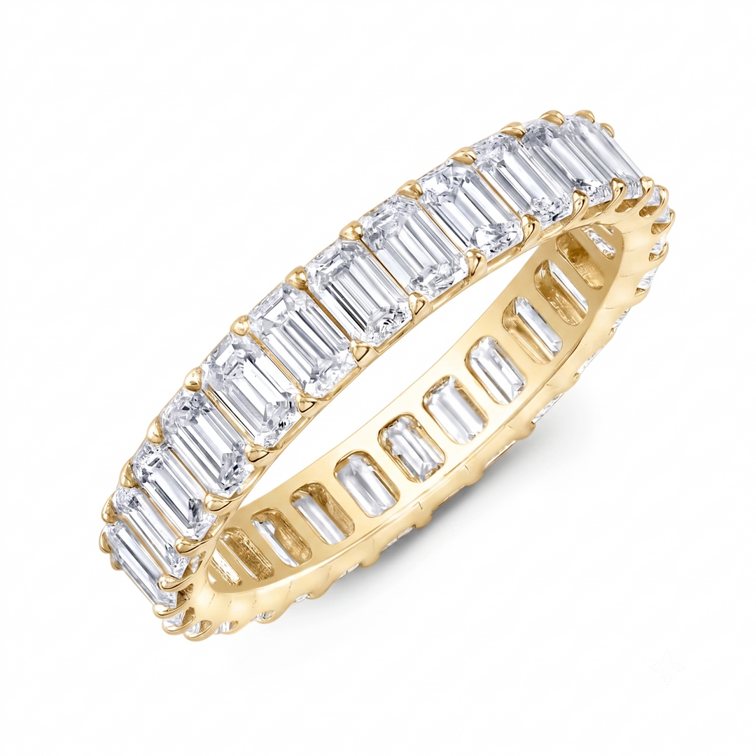 emerald cut eternity band low profile yellow gold