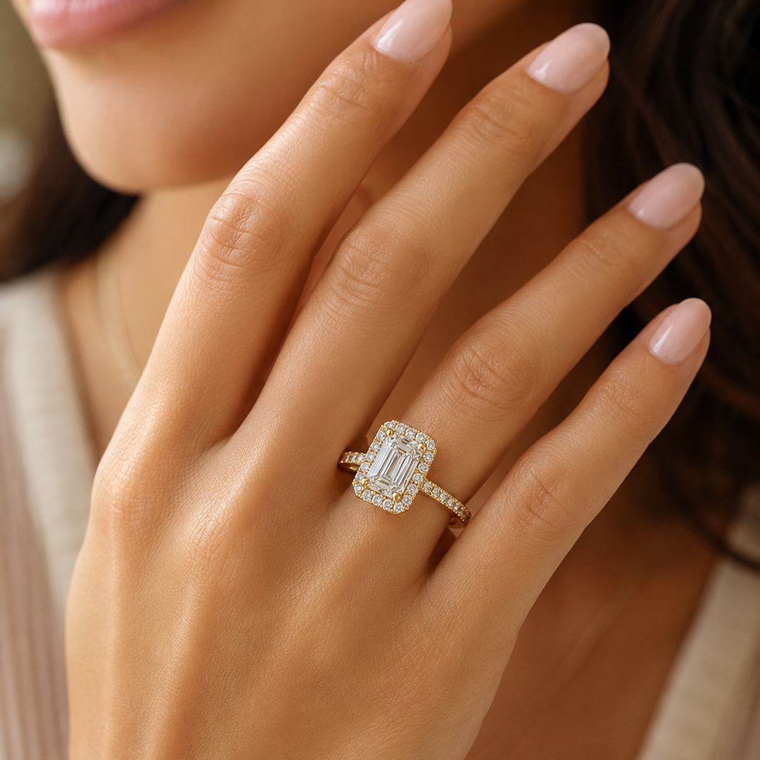 halo emerald cut diamond ring on a model's finger