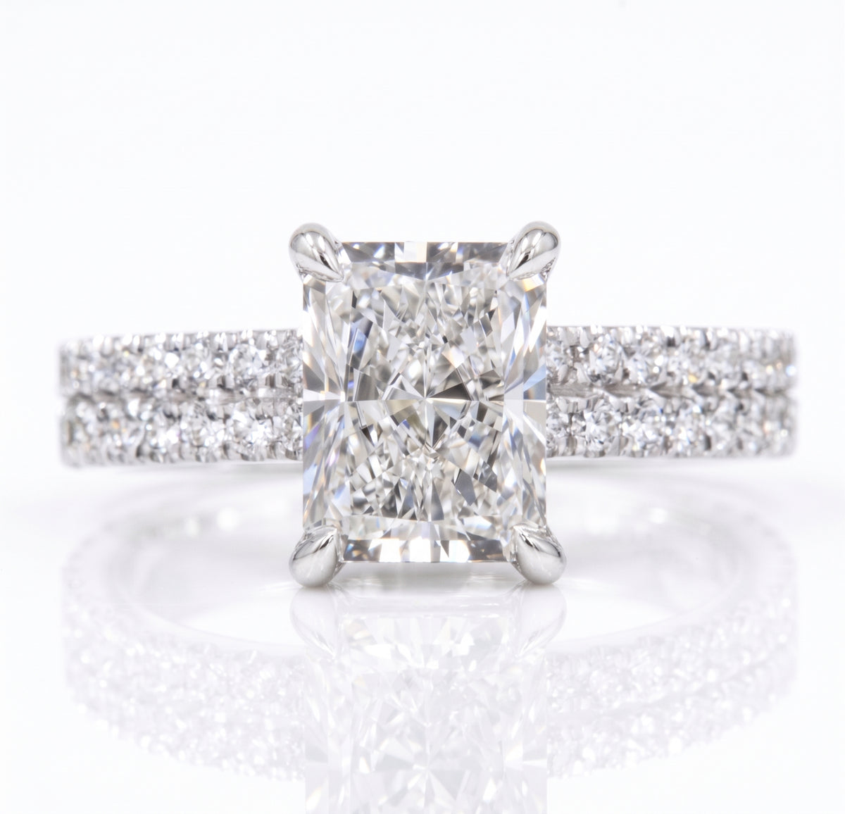 Radiant cut hidden halo two row engagement ring