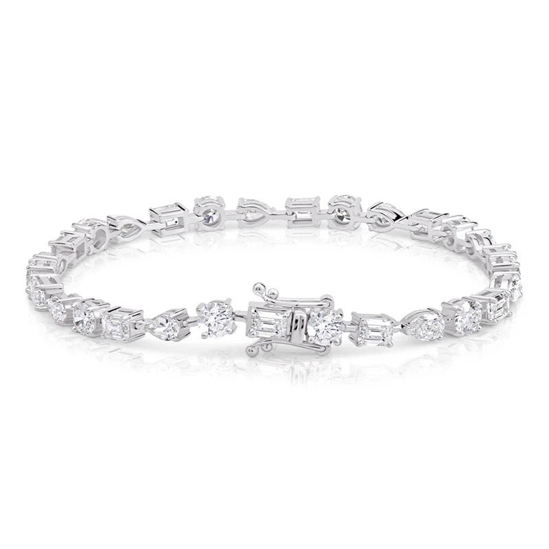 Mixed Shape Emerald, Pear and Round Diamond Tennis Bracelet in white gold showing lock