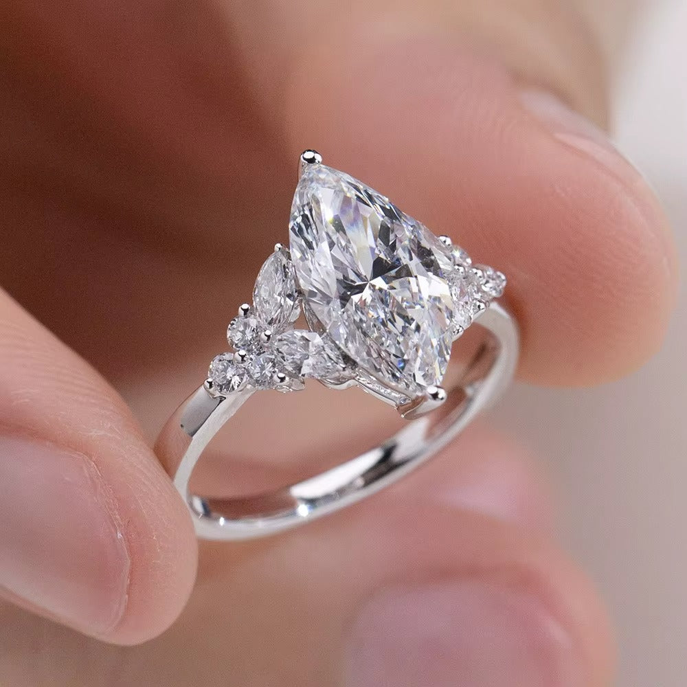 Marquise center Diamond Ring with side marquise and round cut