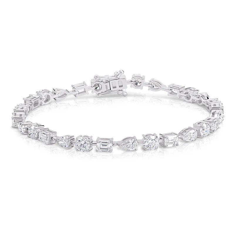 Mixed Shape Emerald, Pear and Round Diamond Tennis Bracelet in white gold