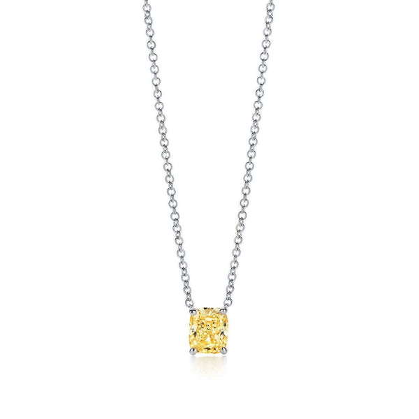 A necklace featuring a cushion cut canary fancy yellow diamond, with a gold pendant and a matching gold chain.