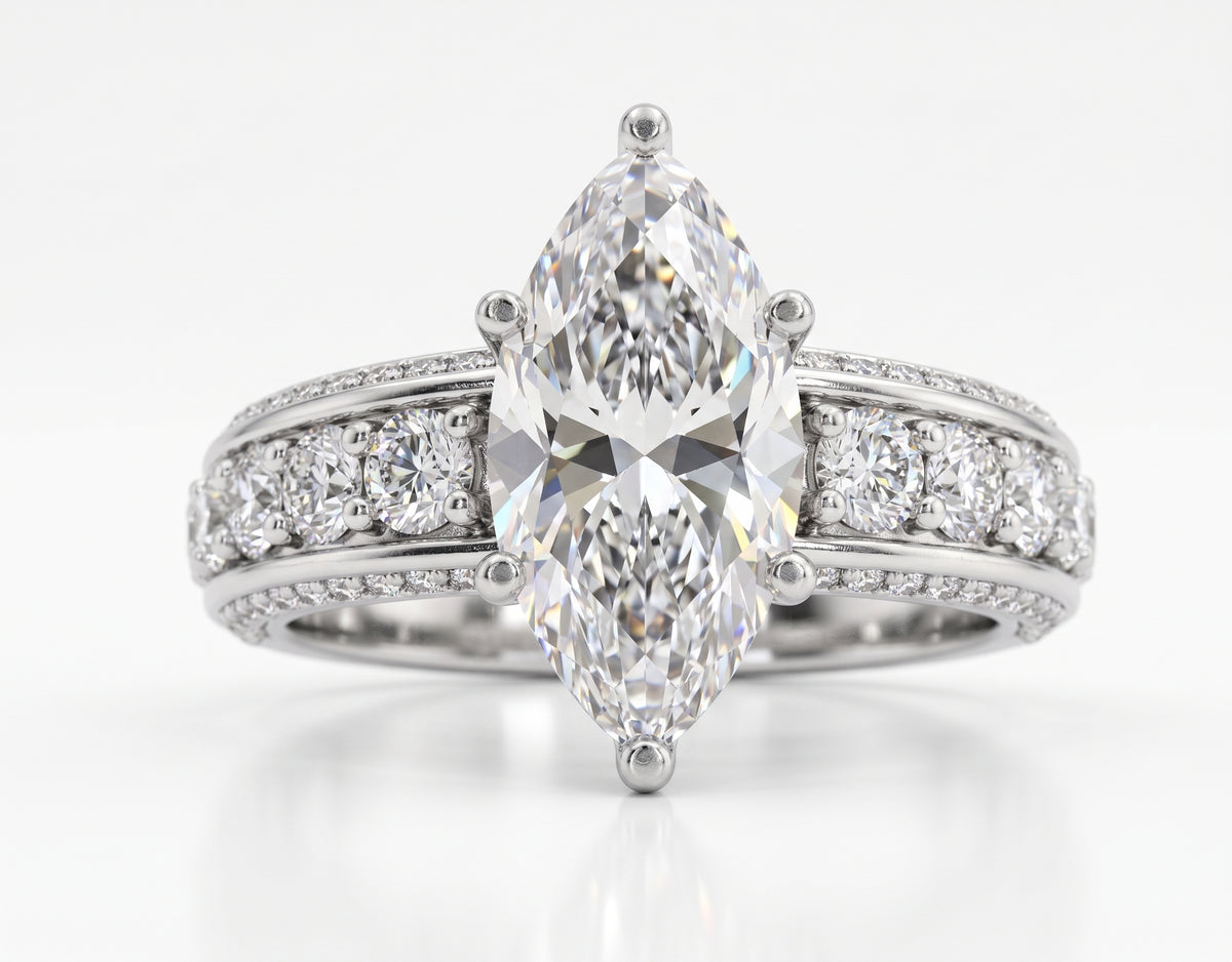 Diamond ring with a marquise shaped center stone on a white background