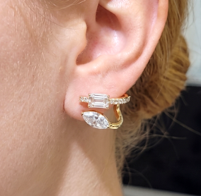 Emerald & Marquise Cut Two-Stone Earrings with Round Pave in yellow gold on model close up