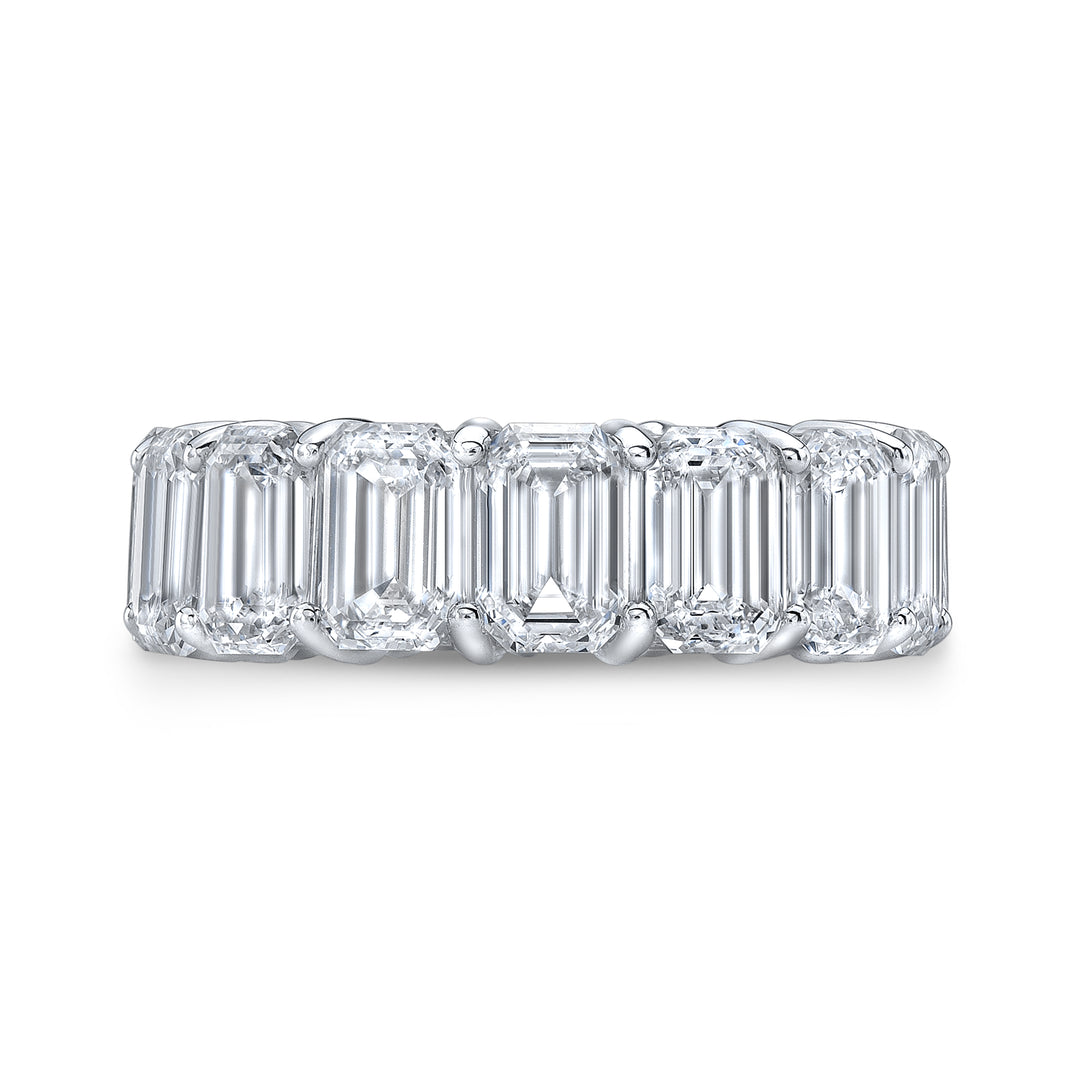 An emerald cut diamond eternity band with multiple stones set in a continuous row, showcasing the band's full circumference.