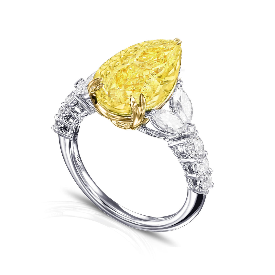 Yellow Pear Cut Center with white Marquise & Round Diamond Ring in white gold side profile