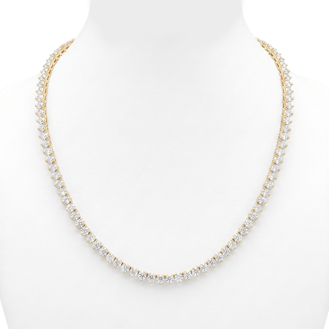 round cut tennis necklace 3 prong yellow gold white background