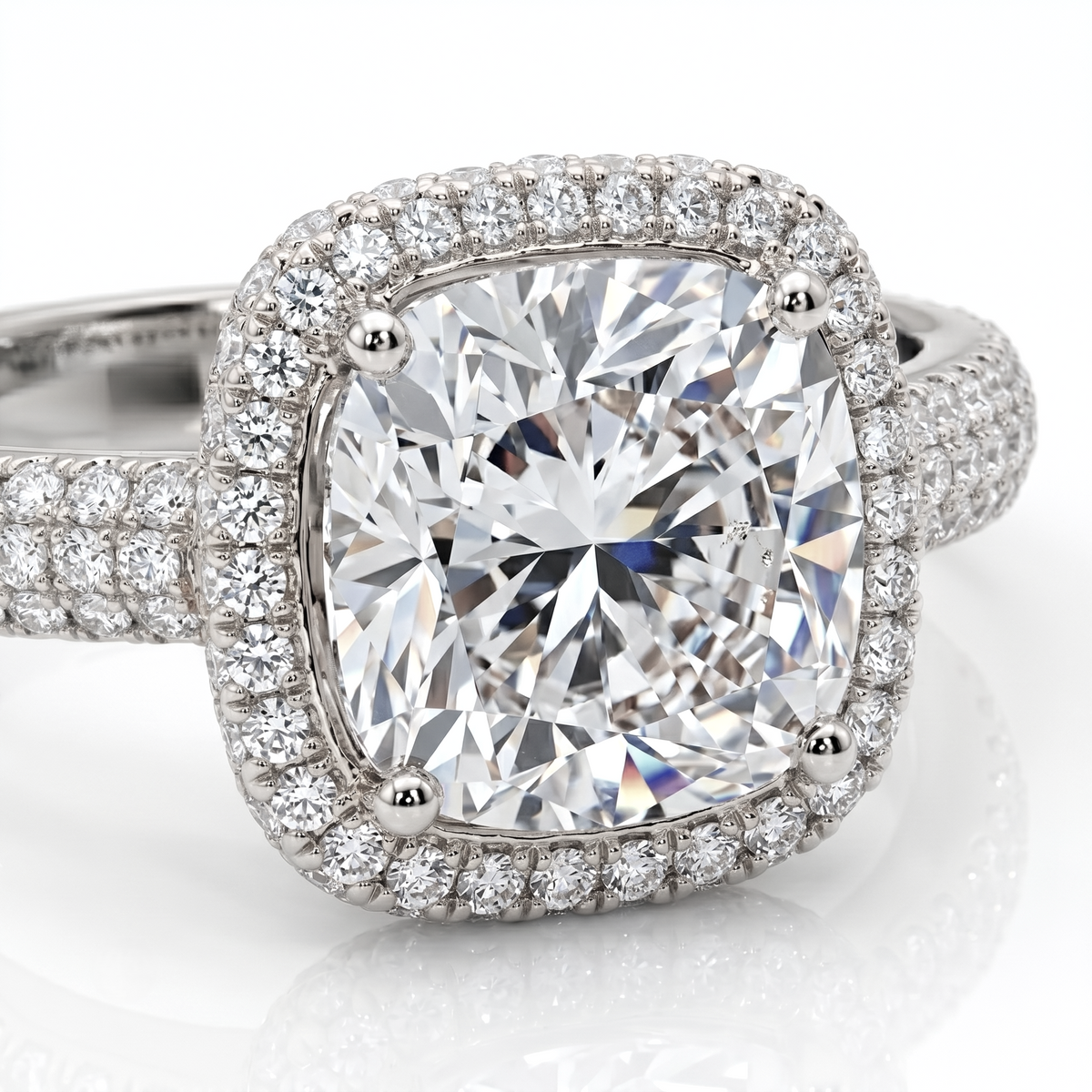 Diamond ring with a large central gemstone and smaller diamonds around on a white background