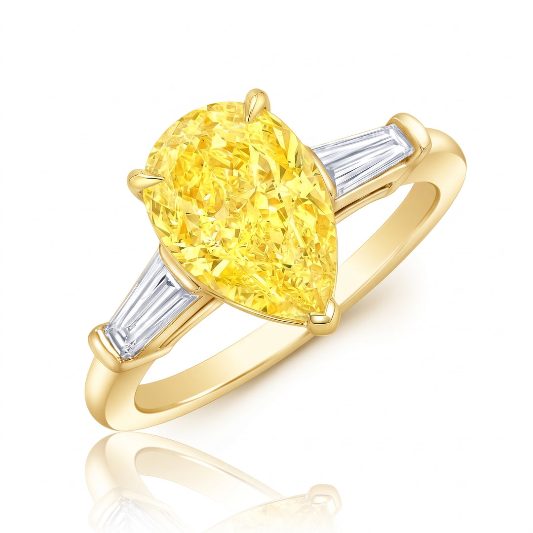 3-stone Pear Cut Yellow with Baguettes side diamond in yellow gold