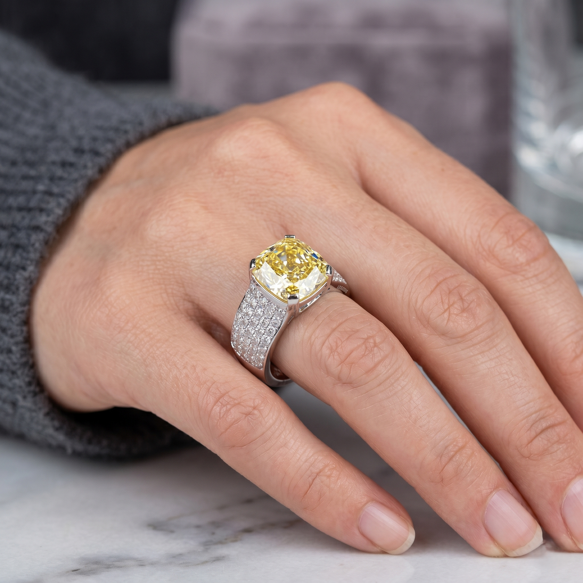Hand wearing cushion fancy yellow wide shank pave ring