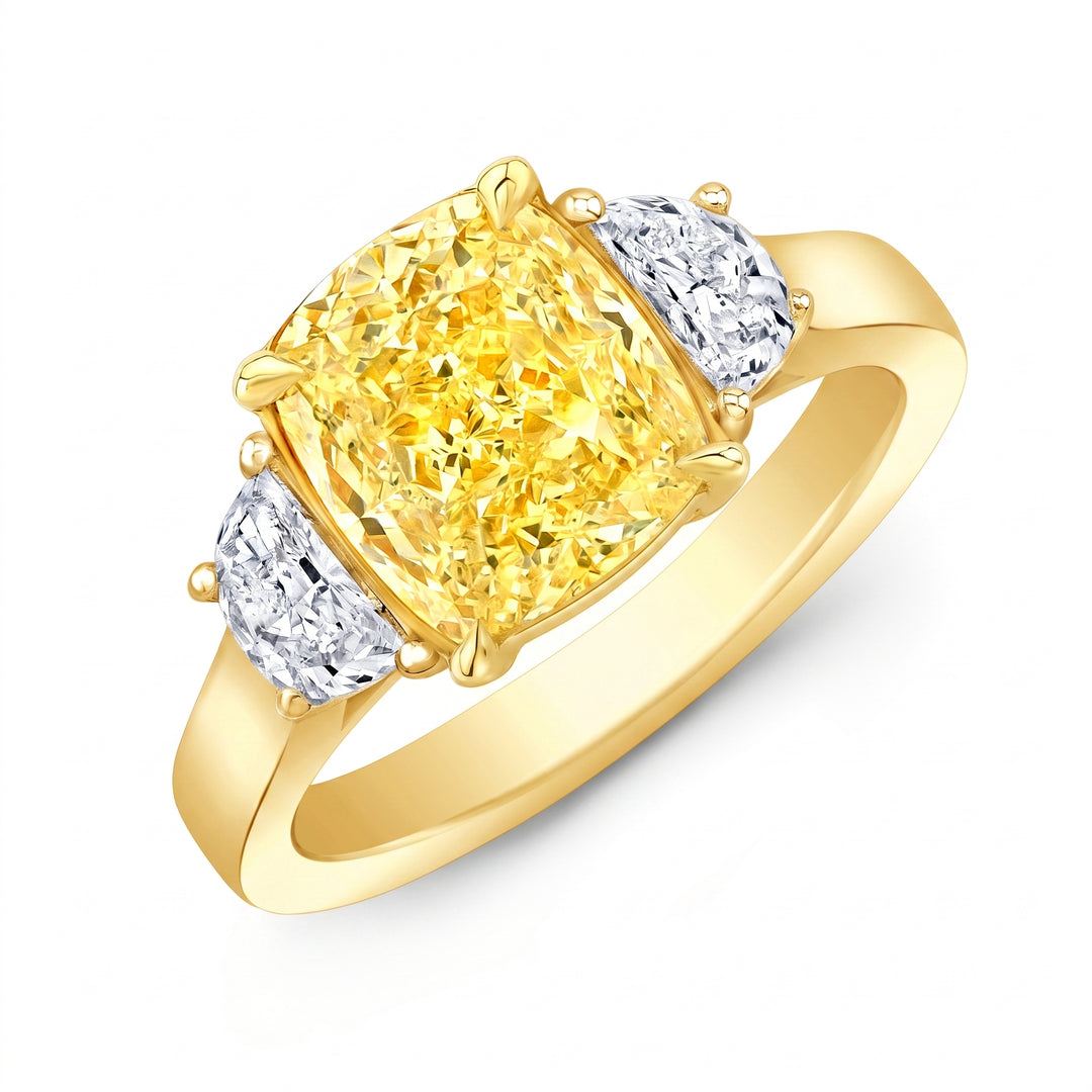 yellow cushion and white half moons on a yellow gold ring