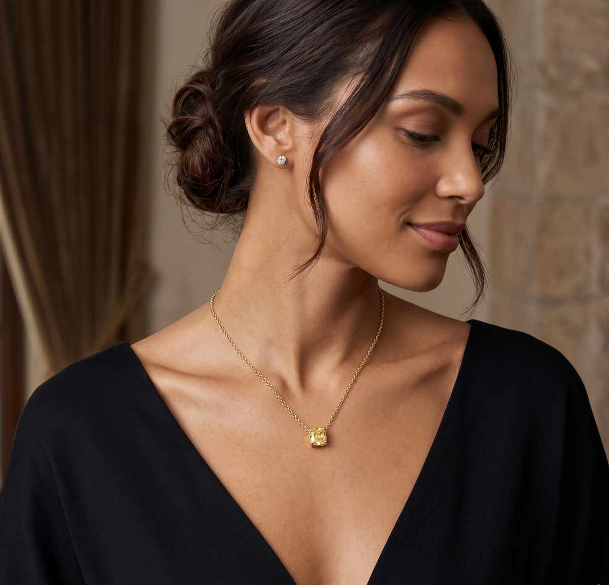 Yellow stone diamond pendant on a model