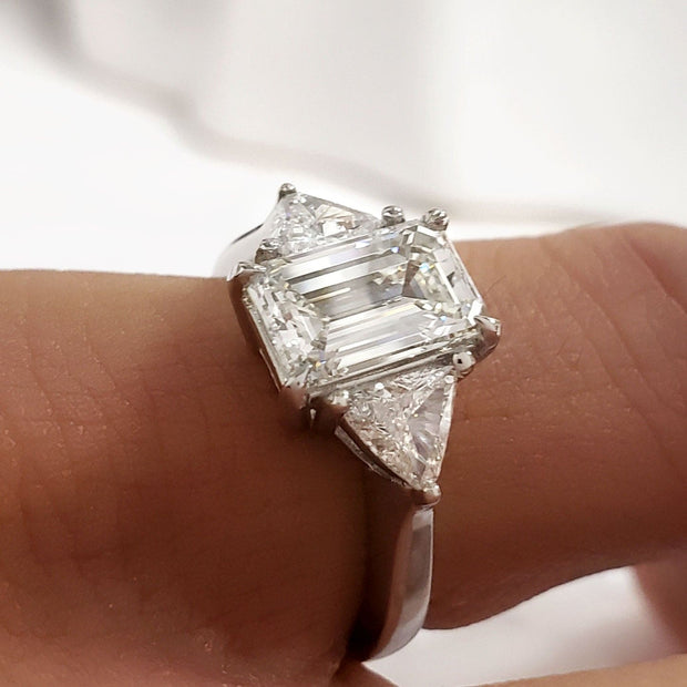 Emerald Cut & Trillions 3Stone Diamond Ring on Hand