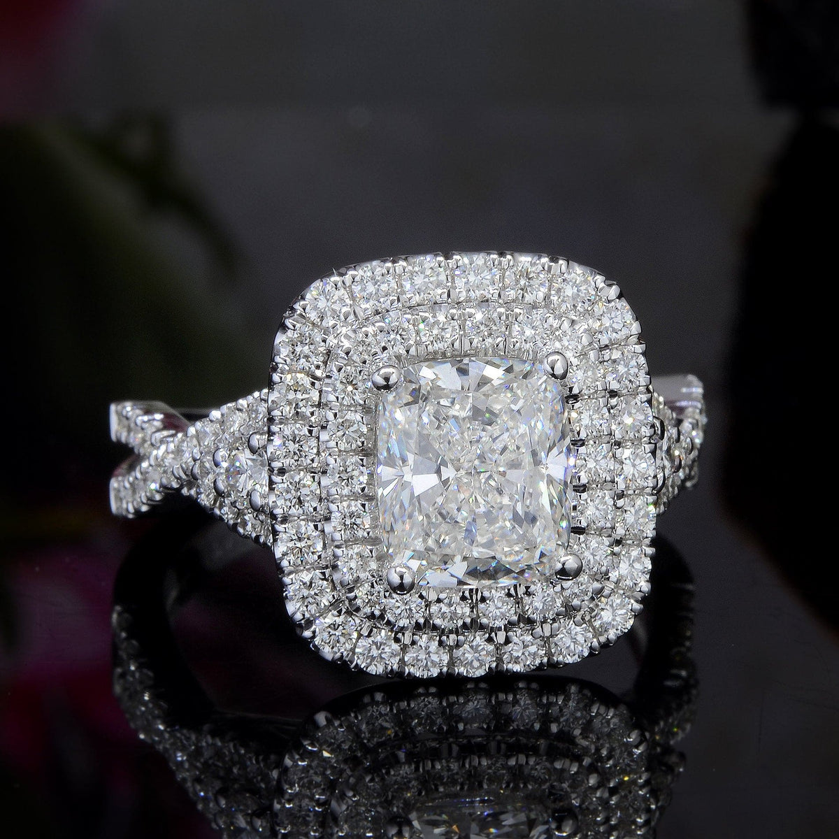 Double halo twist shank engagement ring