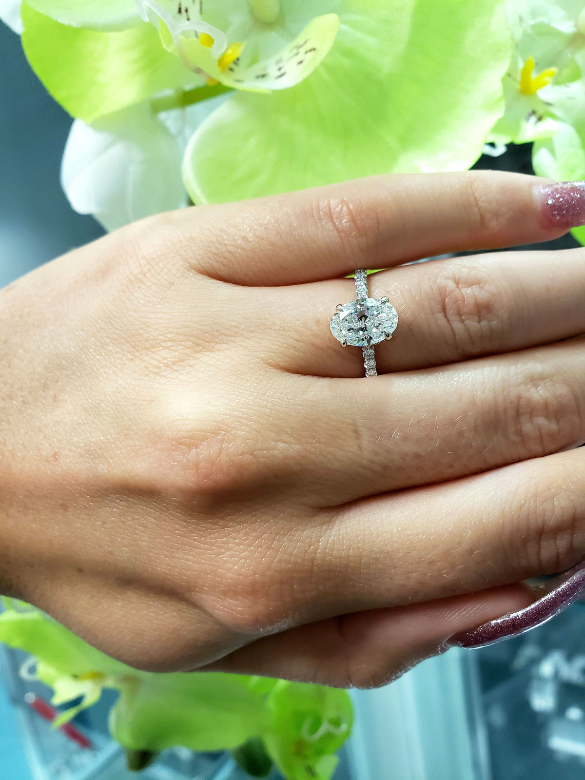 Hidden halo oval engagement ring