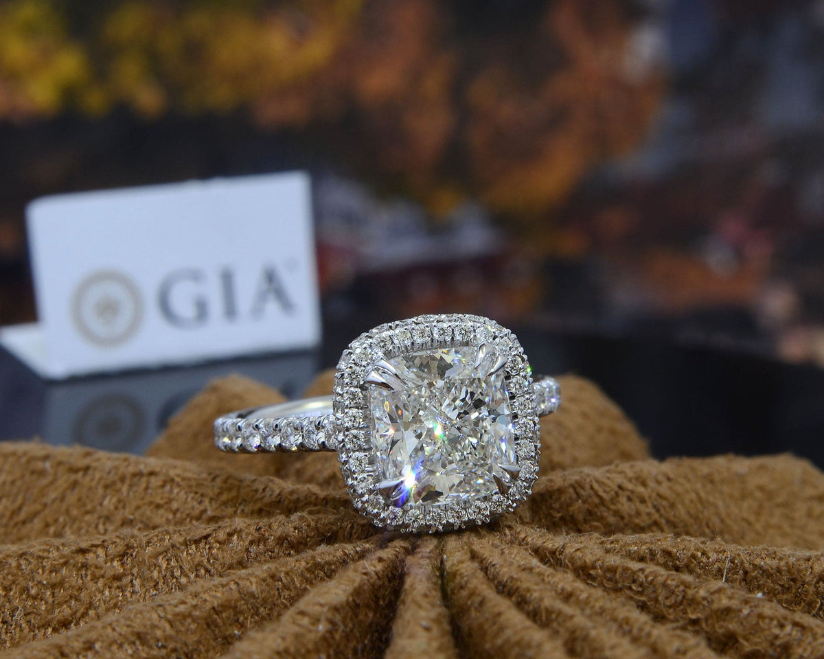 Halo & hidden halo cushion engagement ring