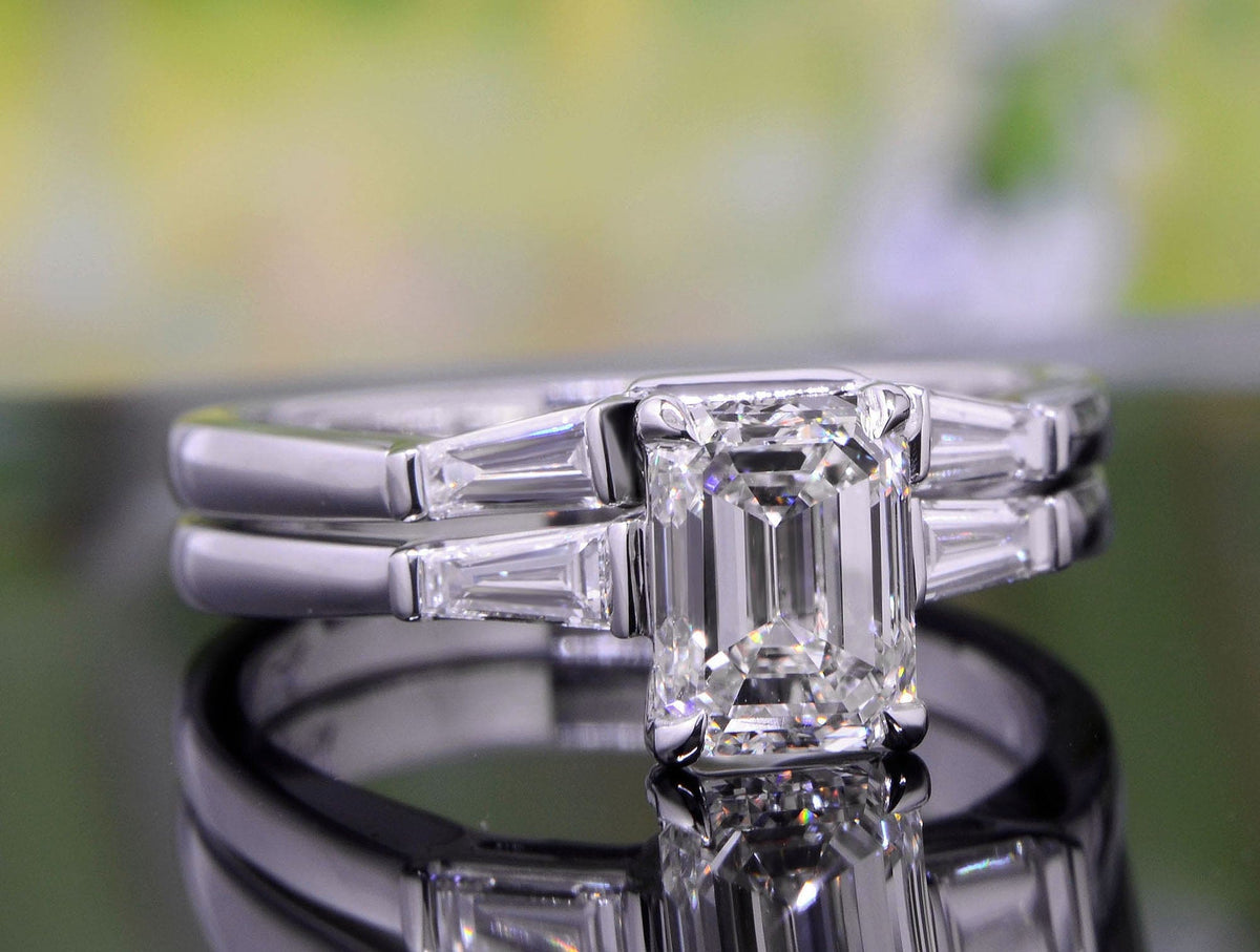 3 stone emerald cut diamond ring set front view