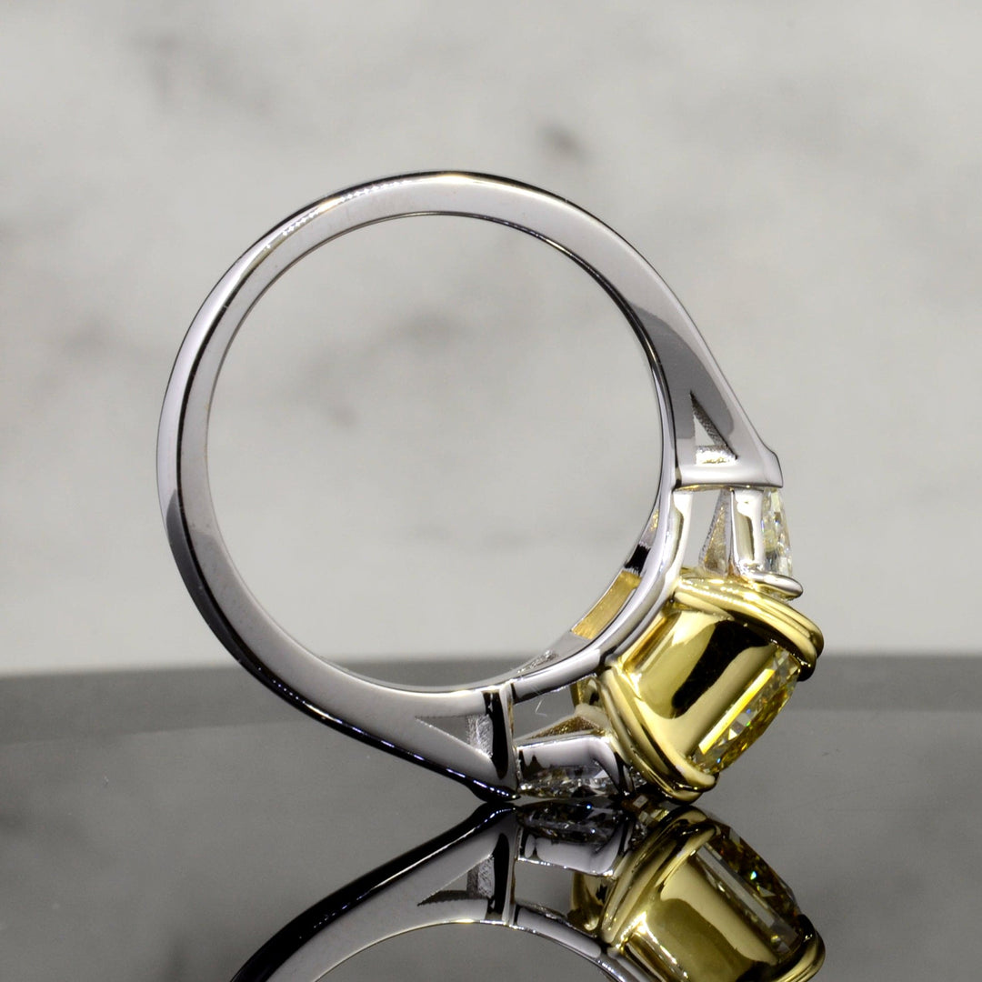 Three Stone Canary Radiant cut with Trillions on the side Side View