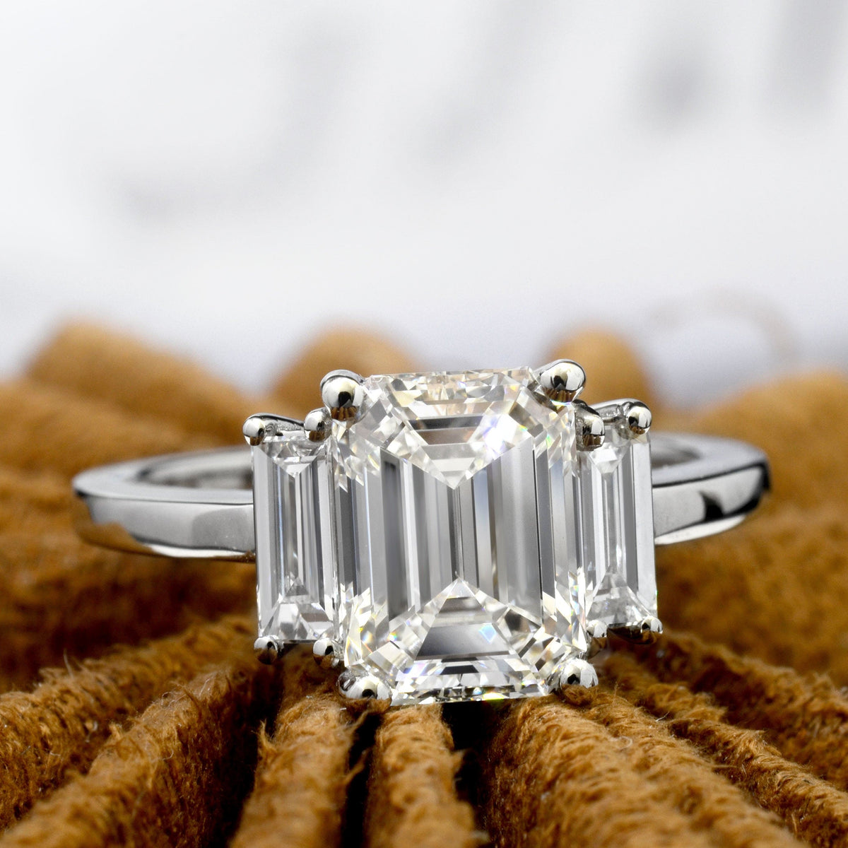 Emerald cut 3 stone engagement ring front