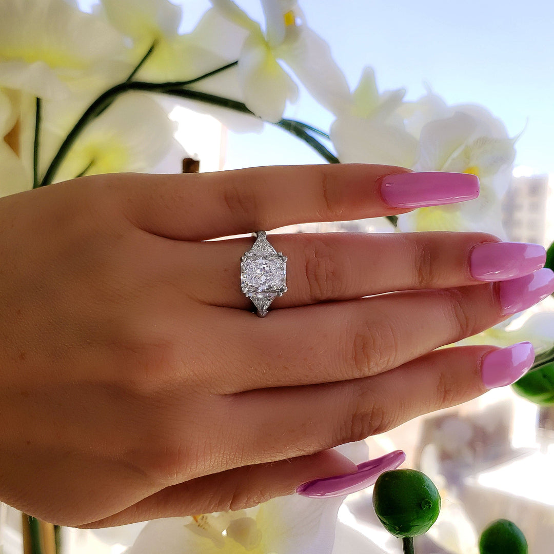3 Stone Radiant Cut Engagement Rings on Hand