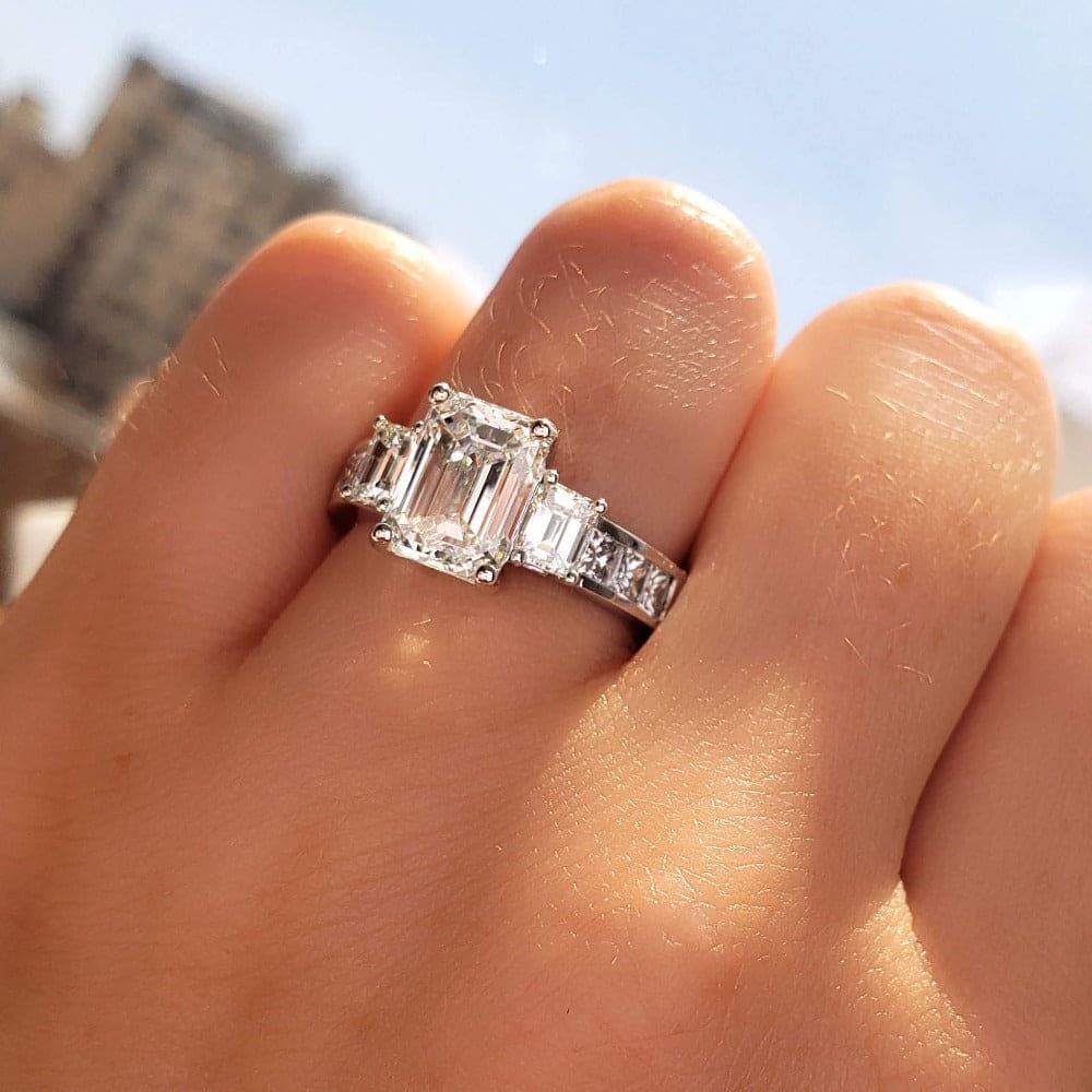 3 carat emerald cut diamond ring on finger Clearance